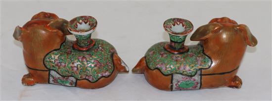 A pair of Chinese export enamelled porcelain Buddhist lion vases, mid 19th century, length 12.5cm